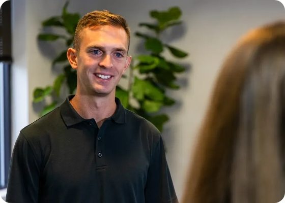 Man talking to dental team member