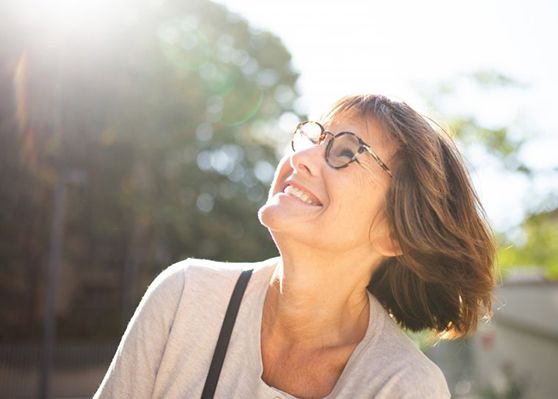 Lady smiles at the sun