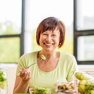 Patient in Garner eating healthy with dentures
