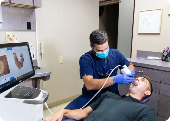Dentist scanning a patients teeth