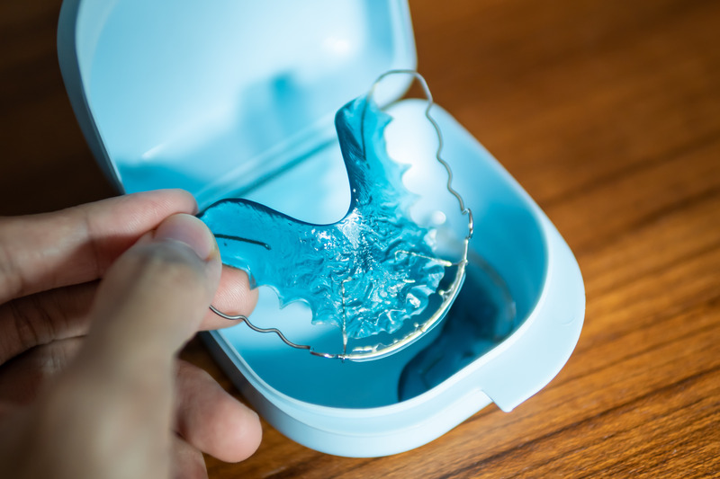 Patient storing their retainer